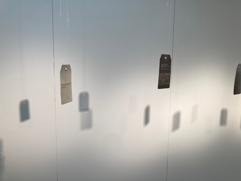 Hanging auction tags with shadows